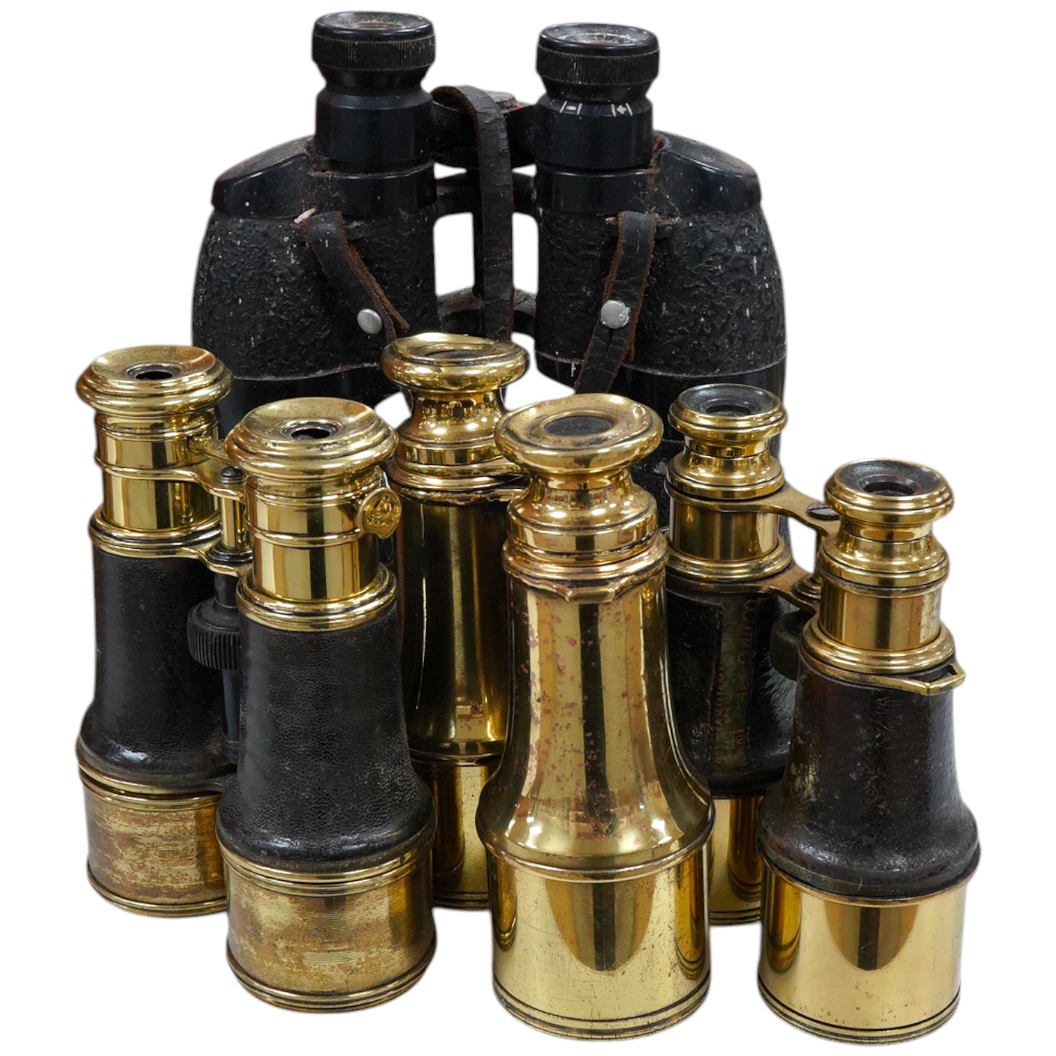 A collection of brass and military binoculars, largest 23cm high (12). Condition - variable